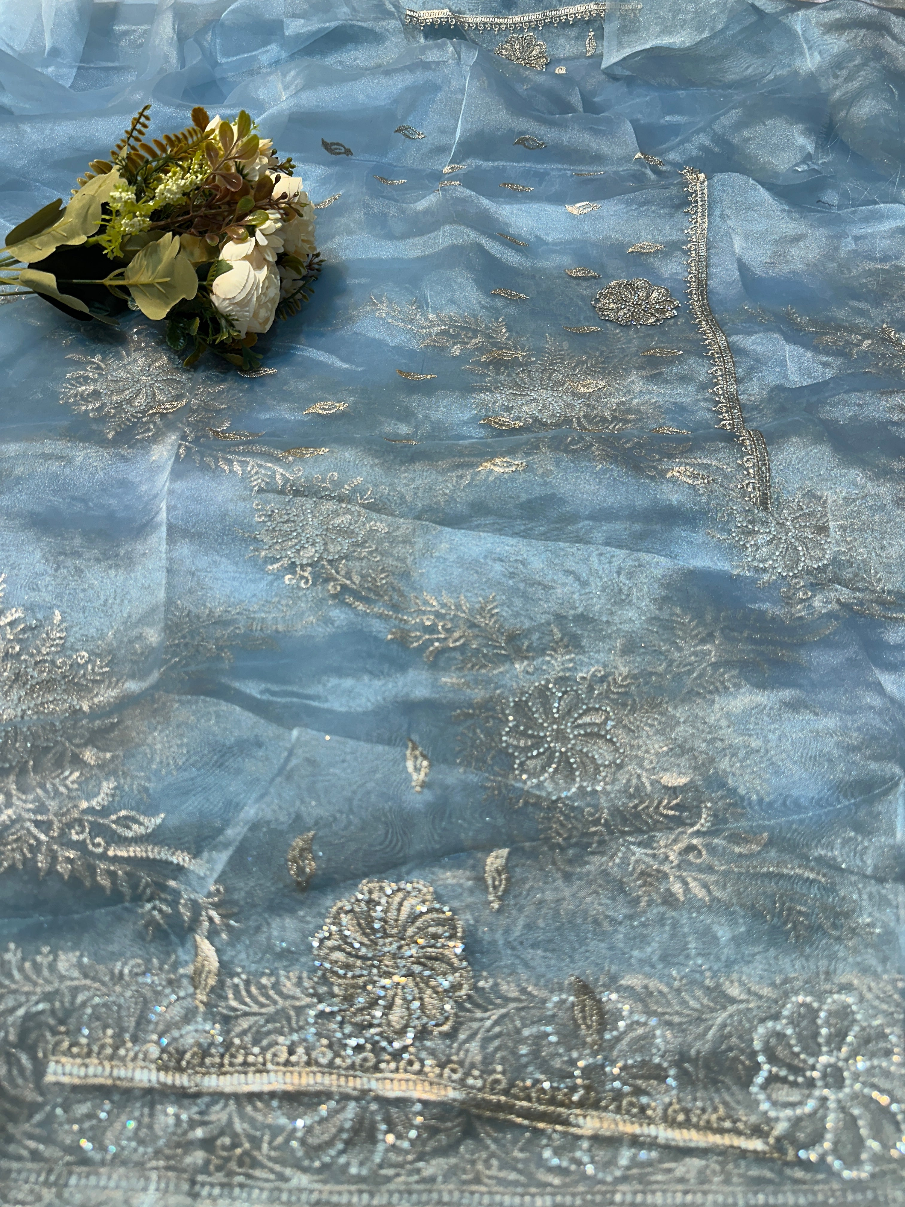 Headline

Graceful Dusty Blue Organza Saree with Silver Embroidered Border