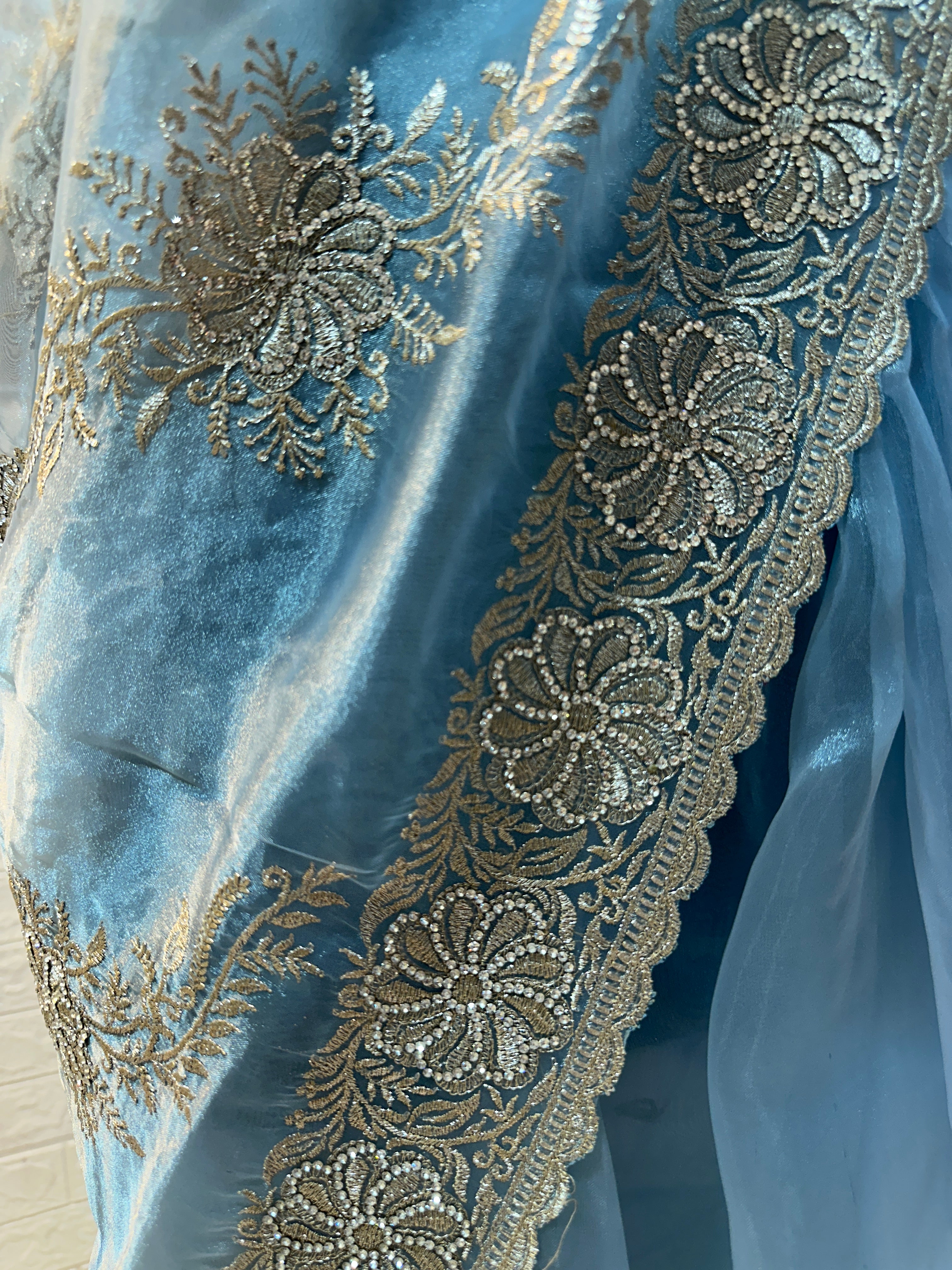 Headline

Graceful Dusty Blue Organza Saree with Silver Embroidered Border