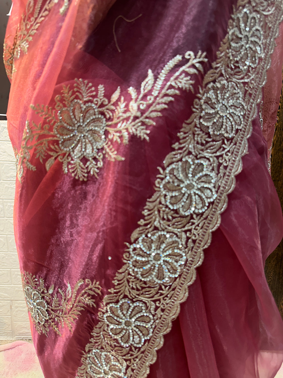Headline 
Dusty Rose Organza Saree with light gold Zari Embroidery