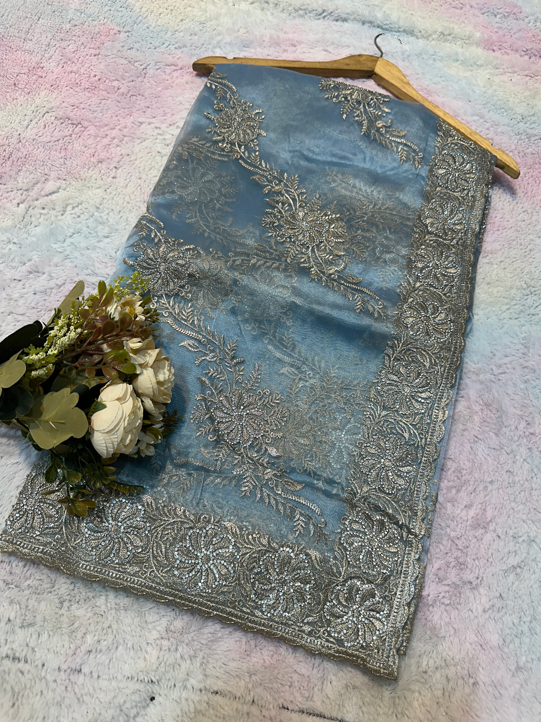 Headline

Graceful Dusty Blue Organza Saree with Silver Embroidered Border