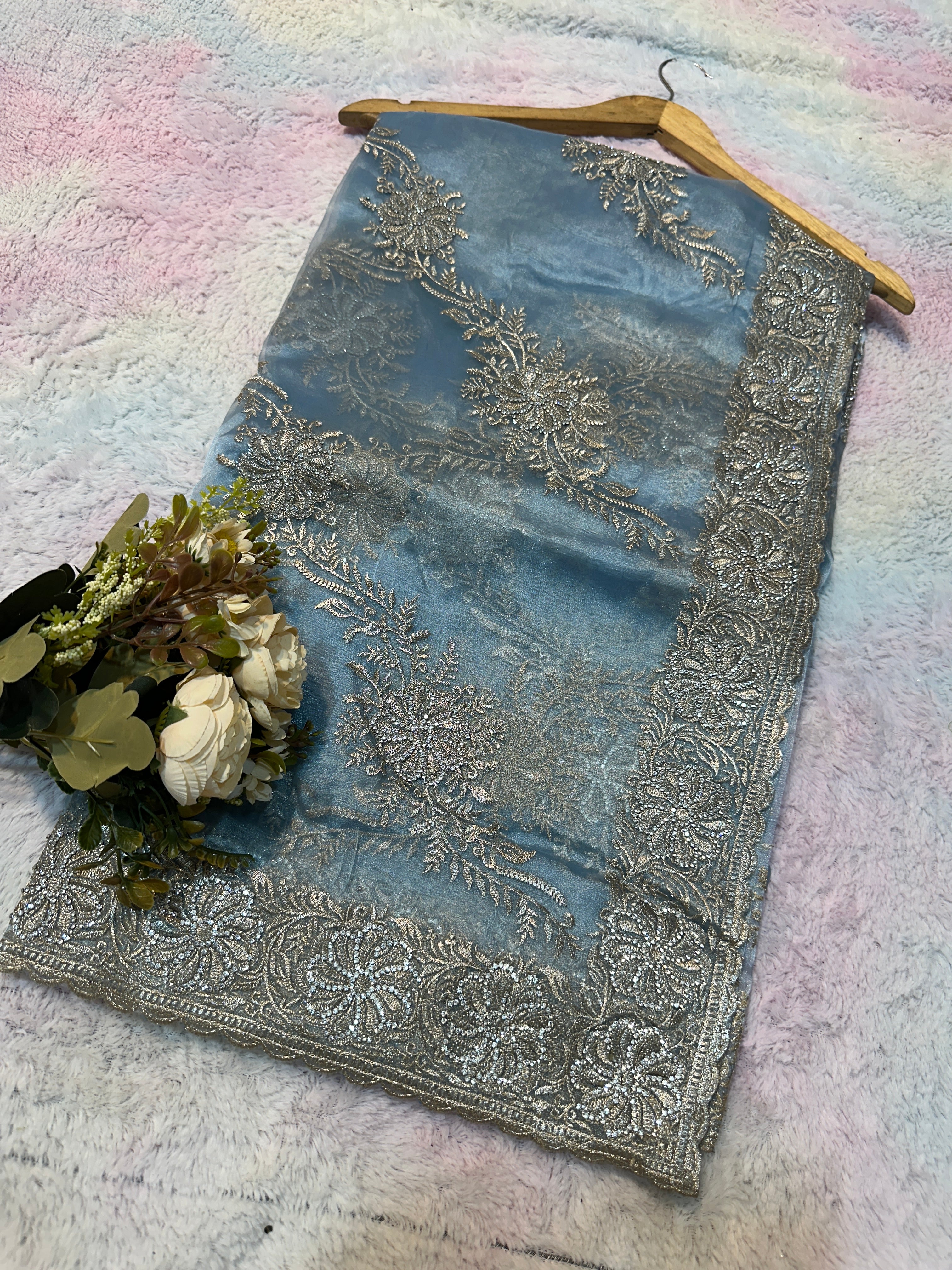 Headline

Graceful Dusty Blue Organza Saree with Silver Embroidered Border